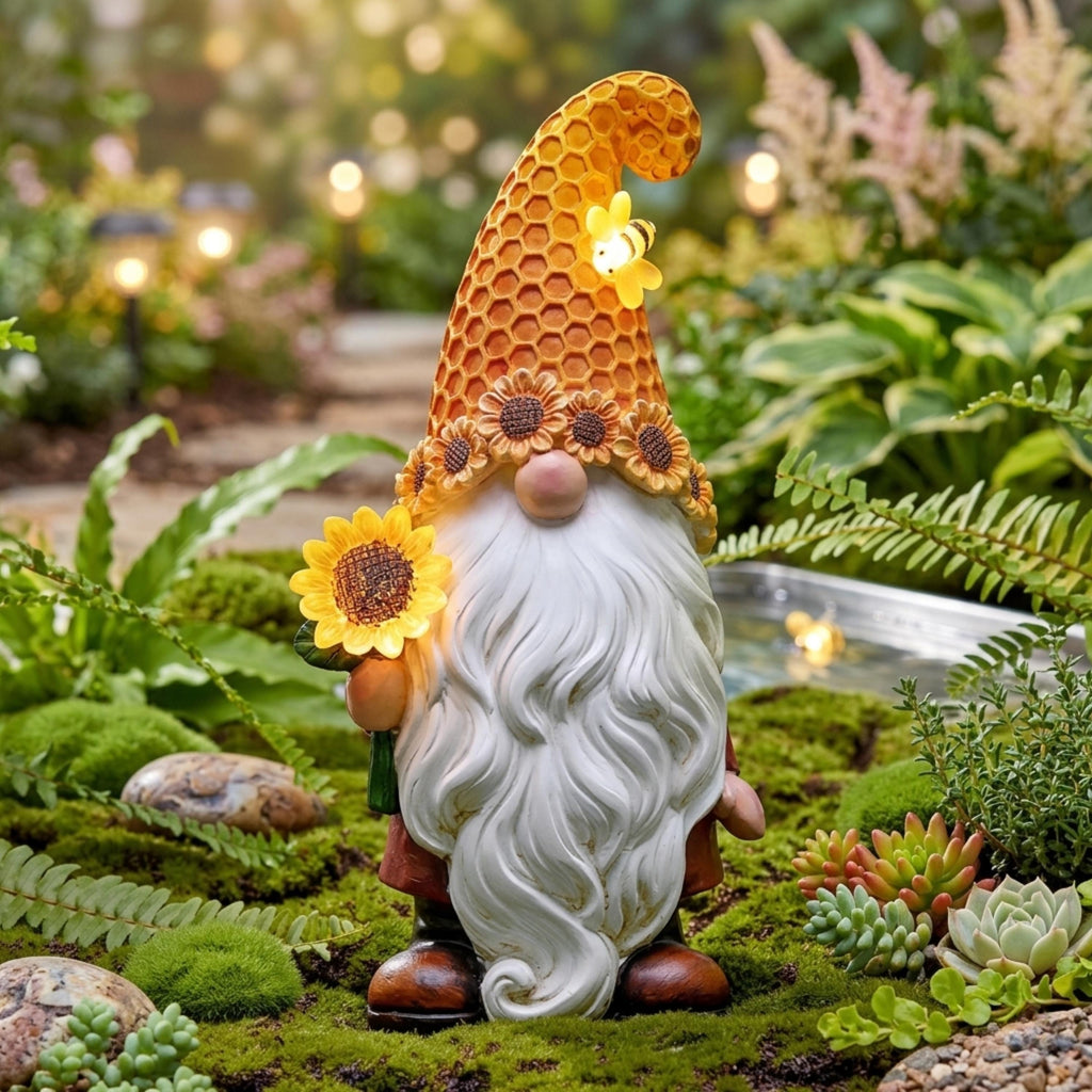 Standing solar sunflower gnome displayed among green plants