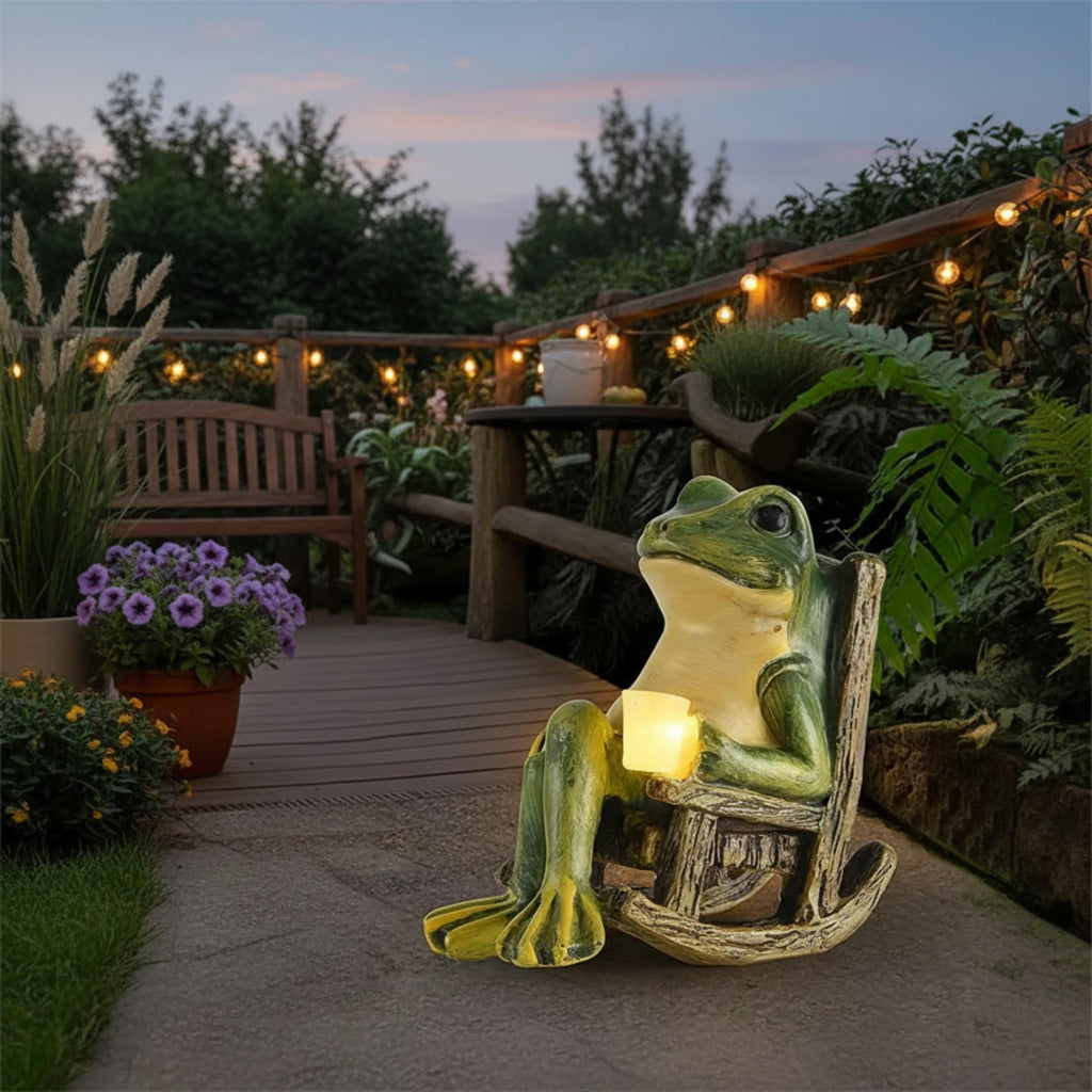 Mini solar frog garden light displayed near a backyard deck at sunset