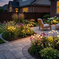 Swaying warm-white solar garden lights around a curved patio bed