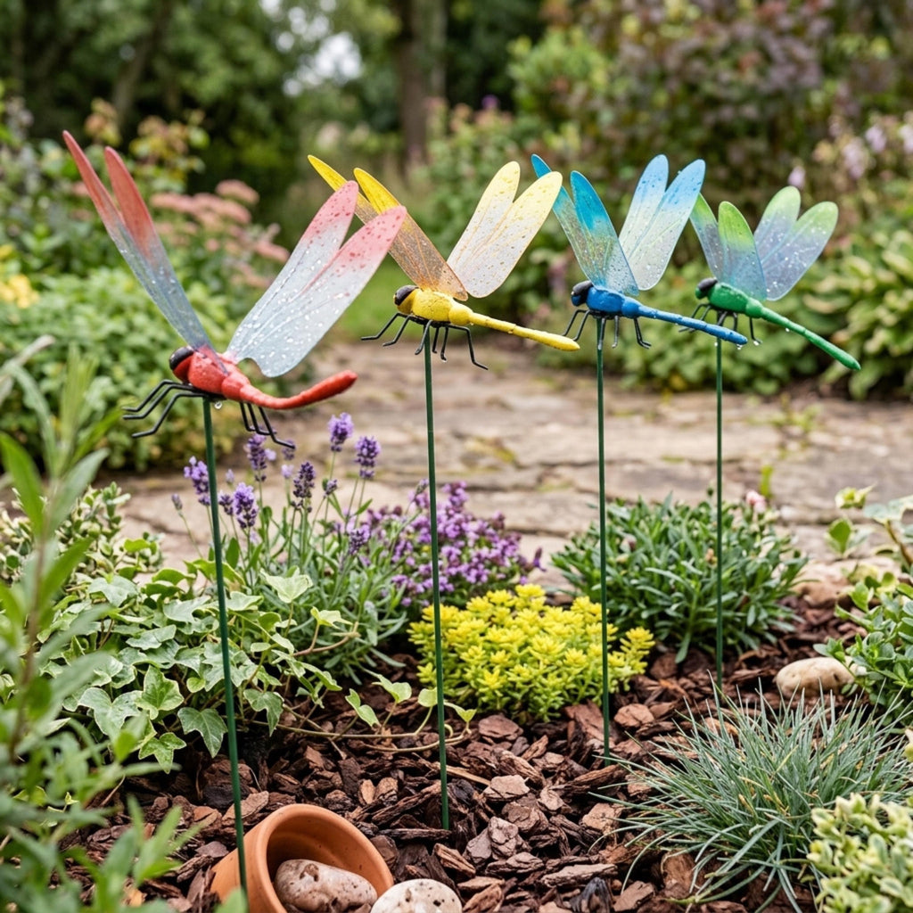 Assorted dragonfly plant stakes arranged along a garden path