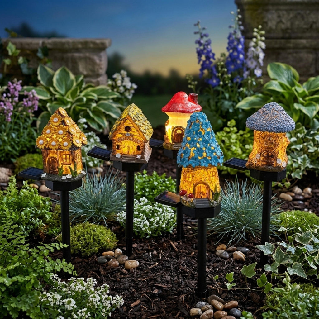 Mixed cottage and mushroom solar lights in a landscaped flower bed
