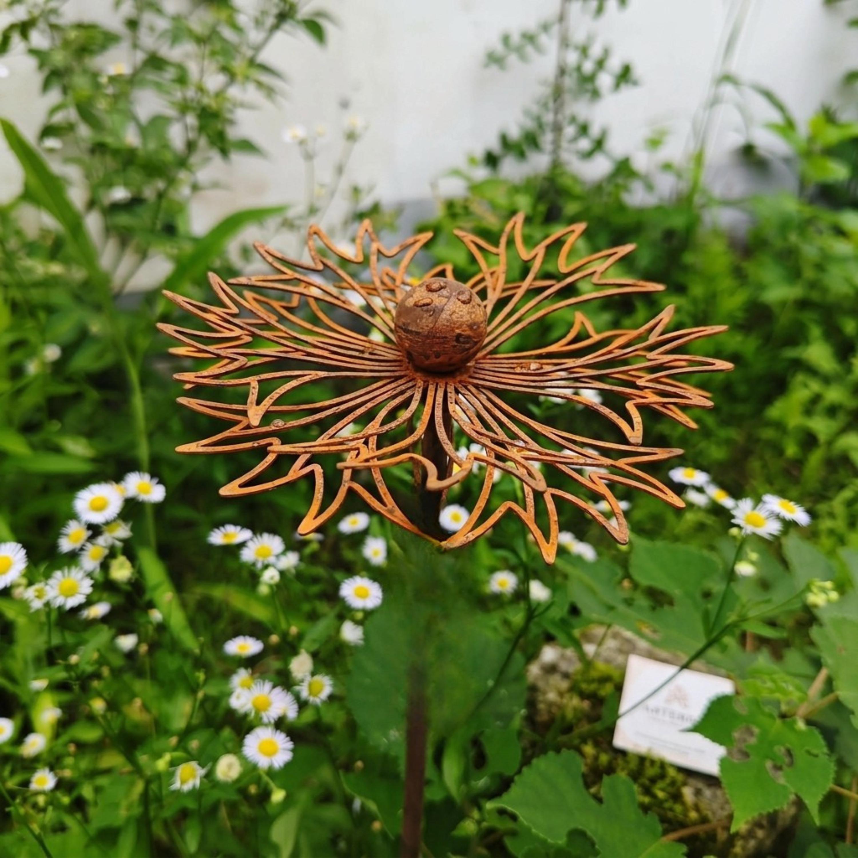 Close-up of openwork rust-finish metal wildflower petals