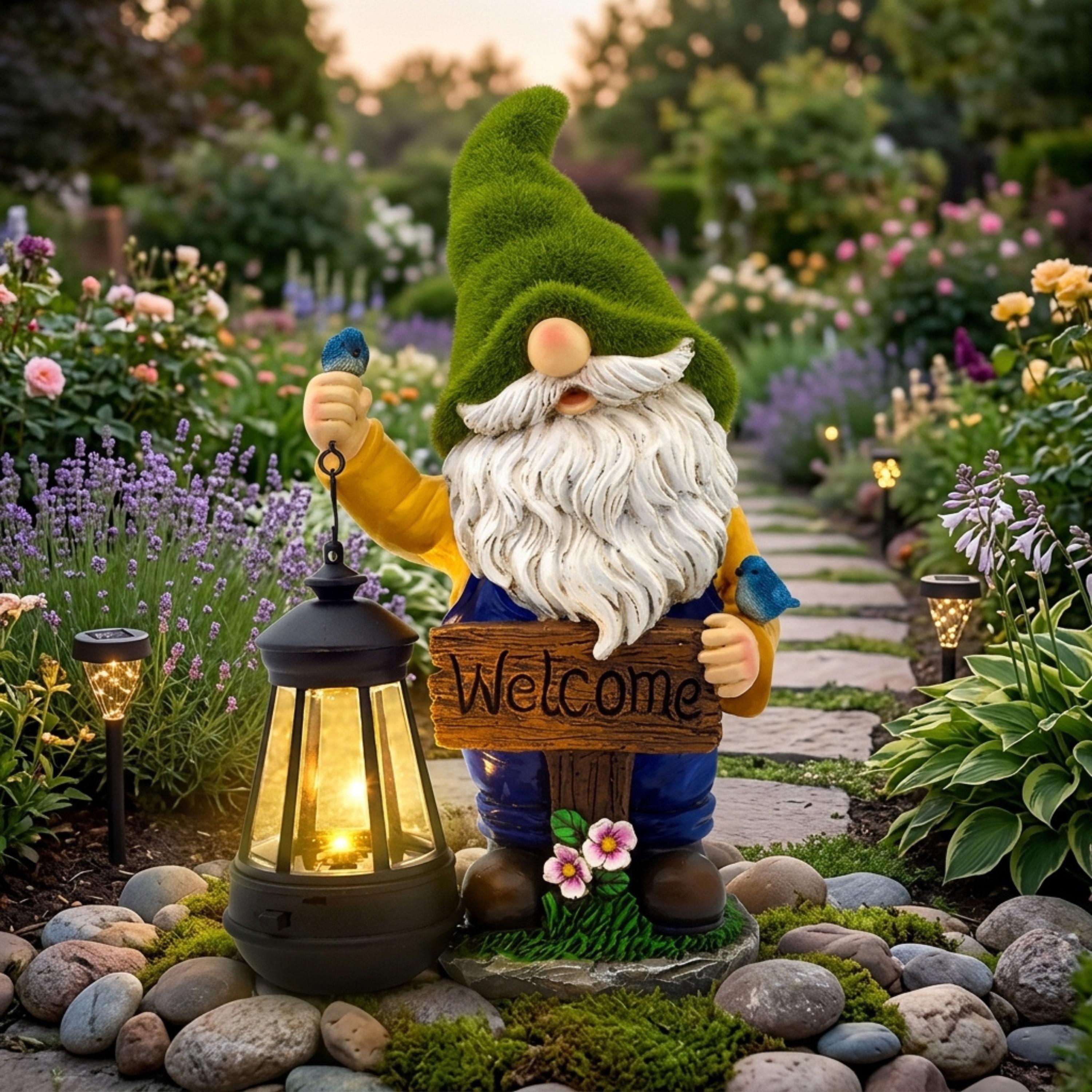 Solar welcome garden gnome holding a glowing lantern beside a flower path