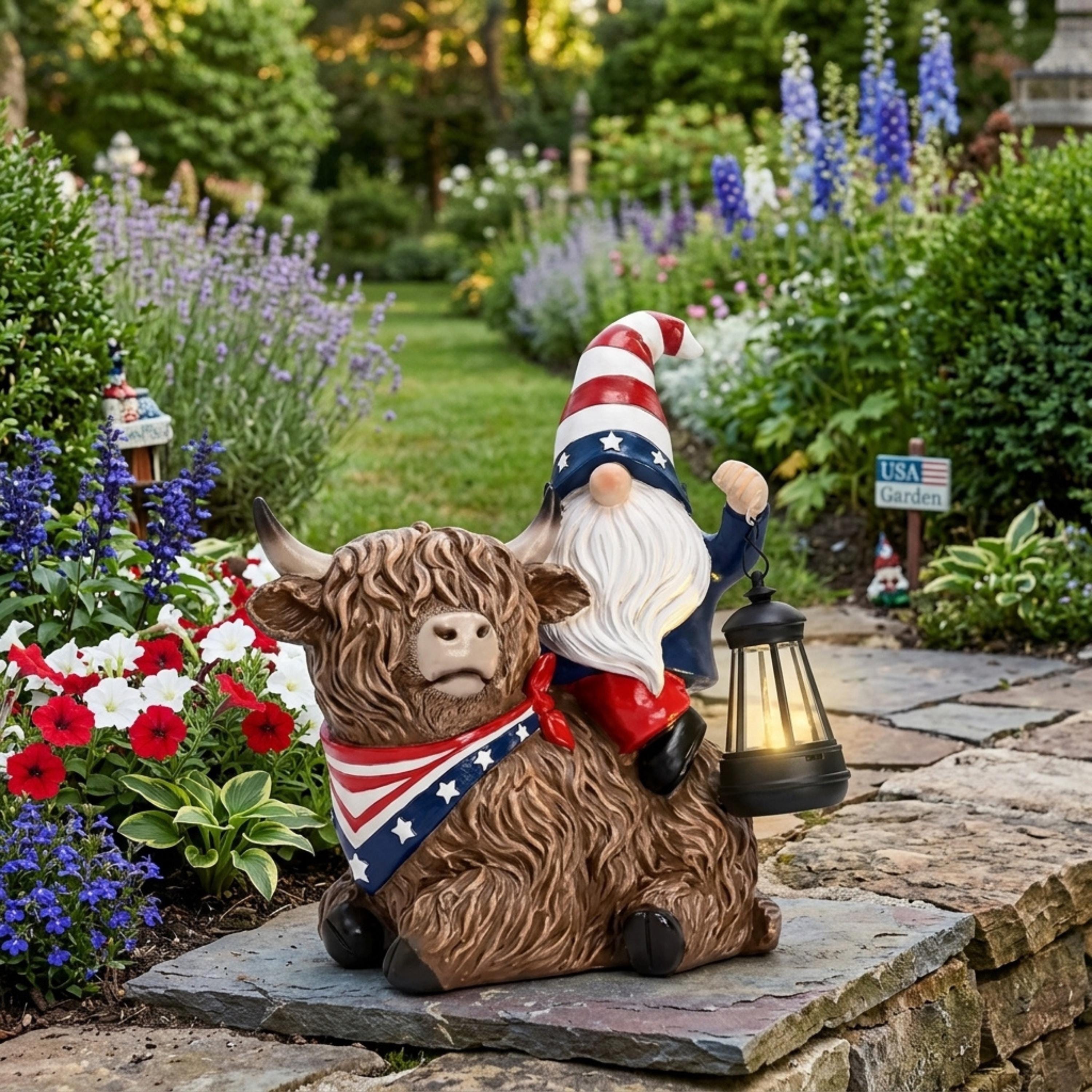 Patriotic cow and gnome lantern statue near lavender and roses