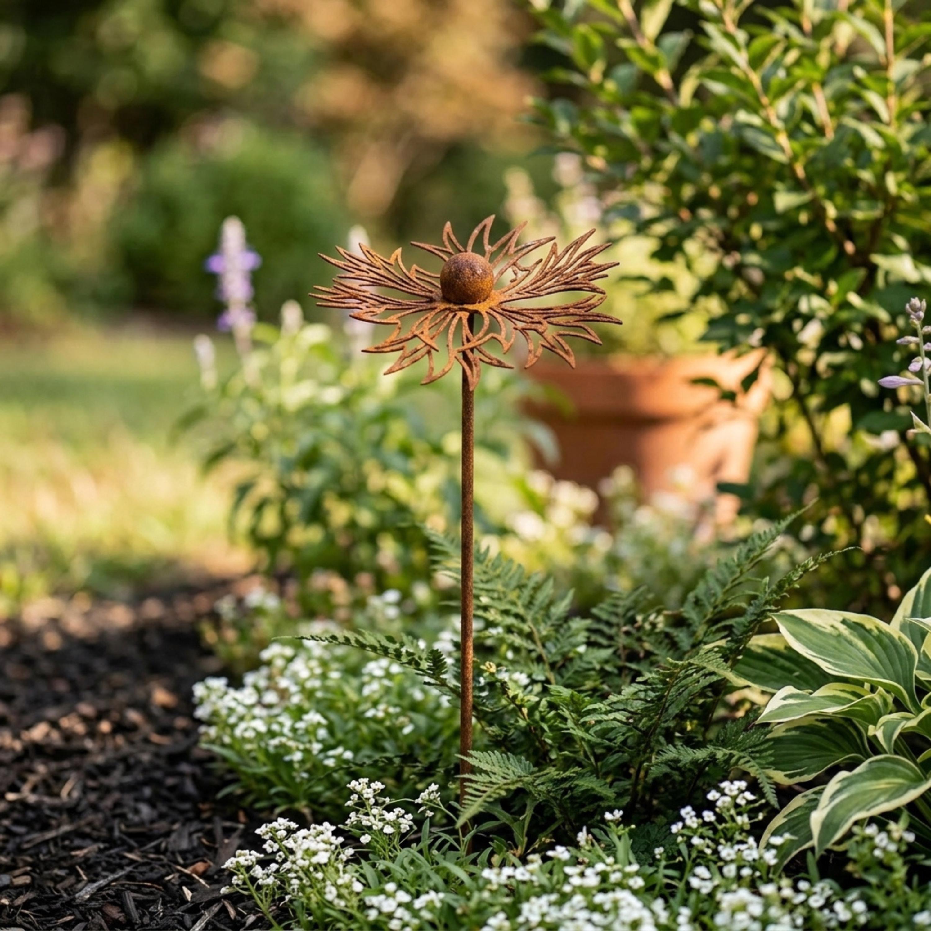 Single metal wildflower garden stake above white flowers and greenery