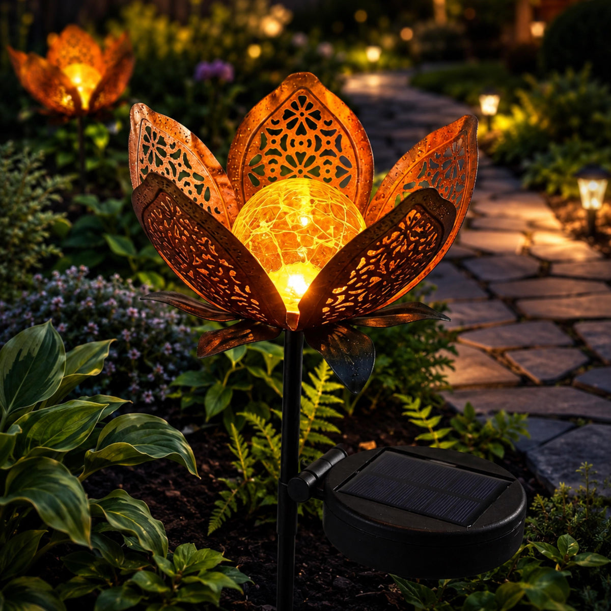 Amber solar lotus flower glowing among hostas beside a path