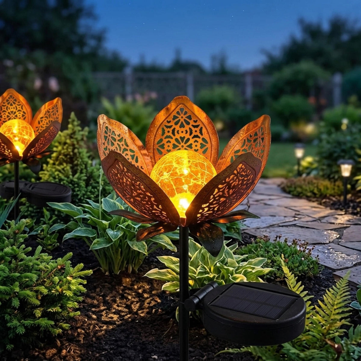 Solar lotus garden light beside a pathway with separate solar panel