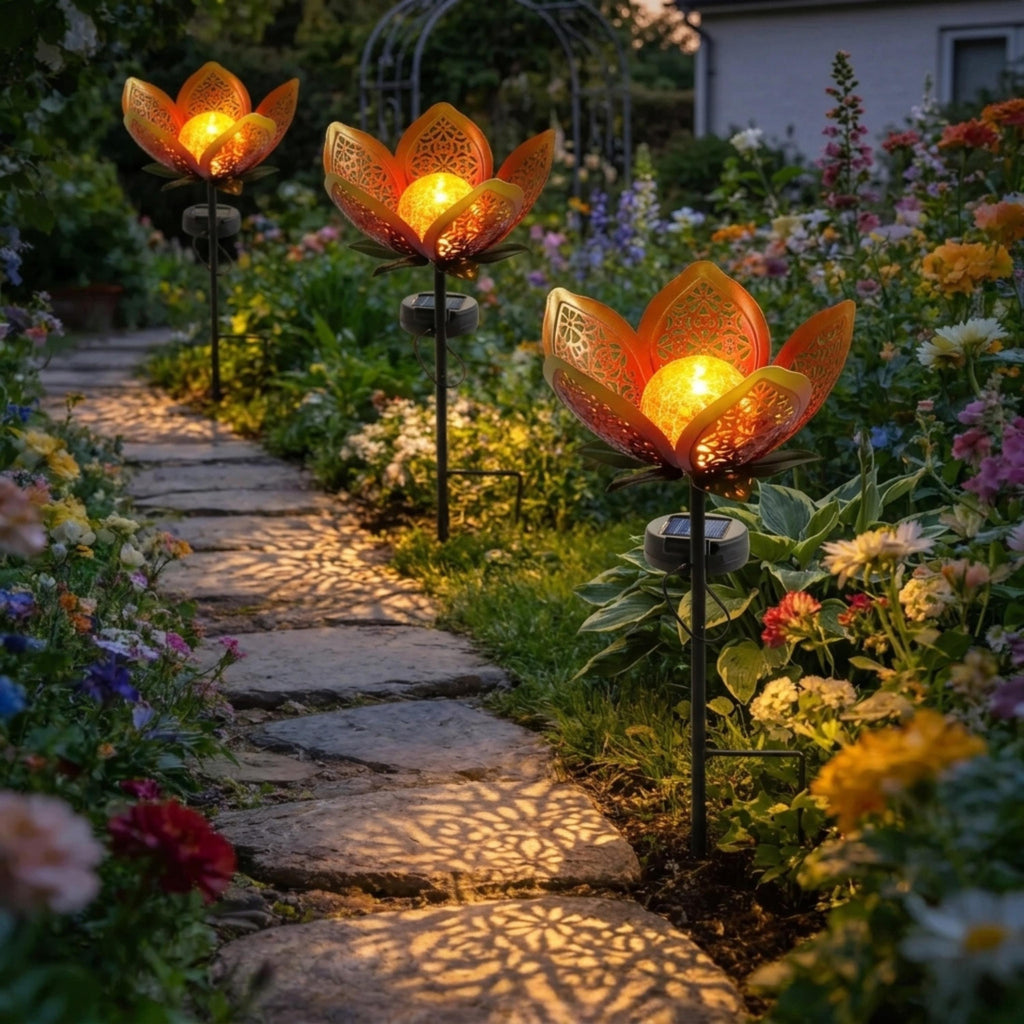 Solar lotus flower lights illuminating a winding garden walkway