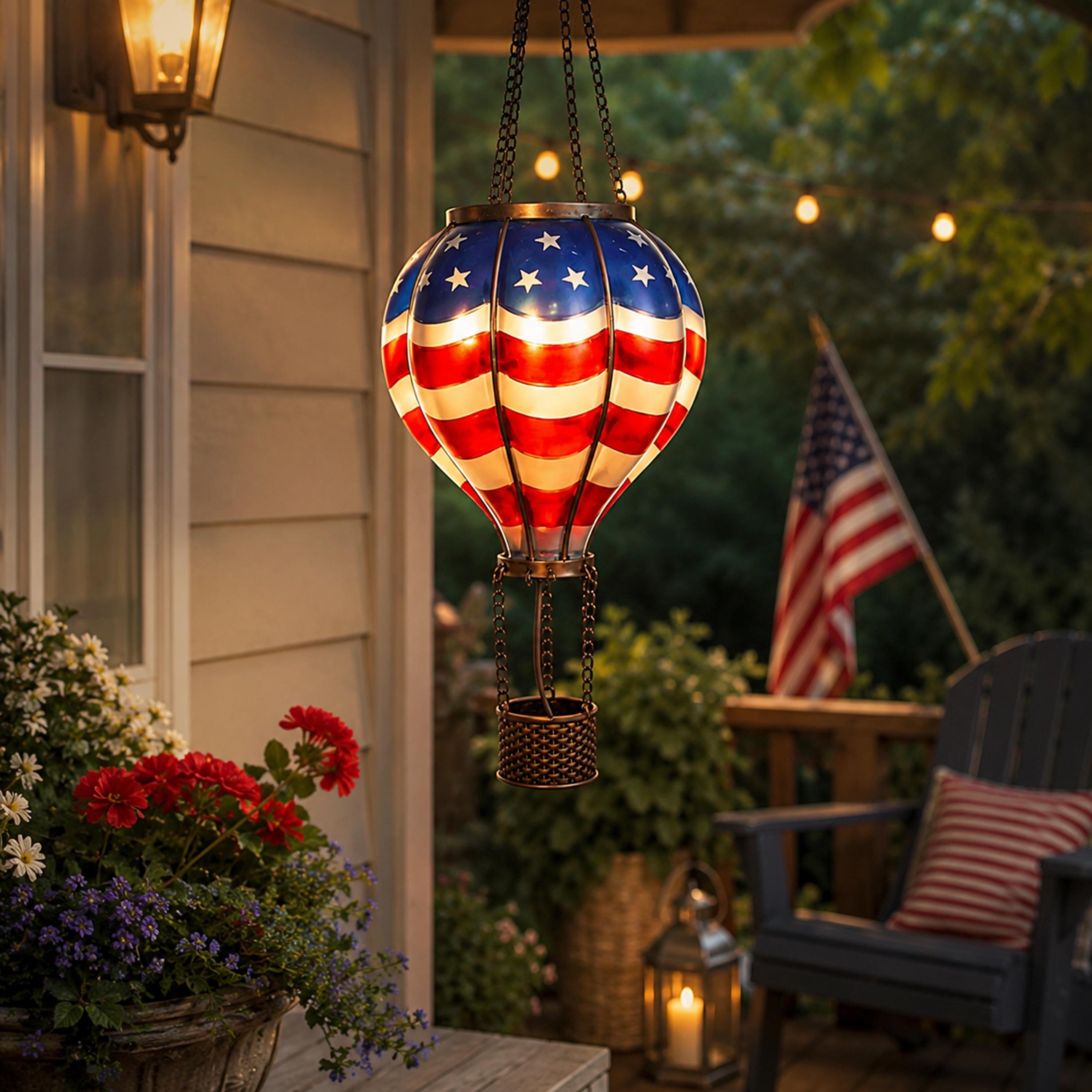 Red white and blue solar balloon lantern near a patio seating area