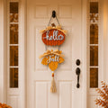 Vertical Hello Fall pumpkin door hanger displayed on an entry door