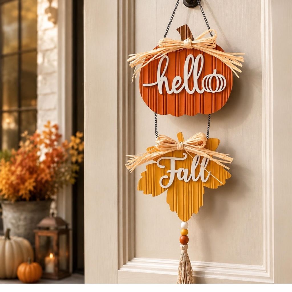 Hello Fall wooden pumpkin and maple leaf door hanger on a white door